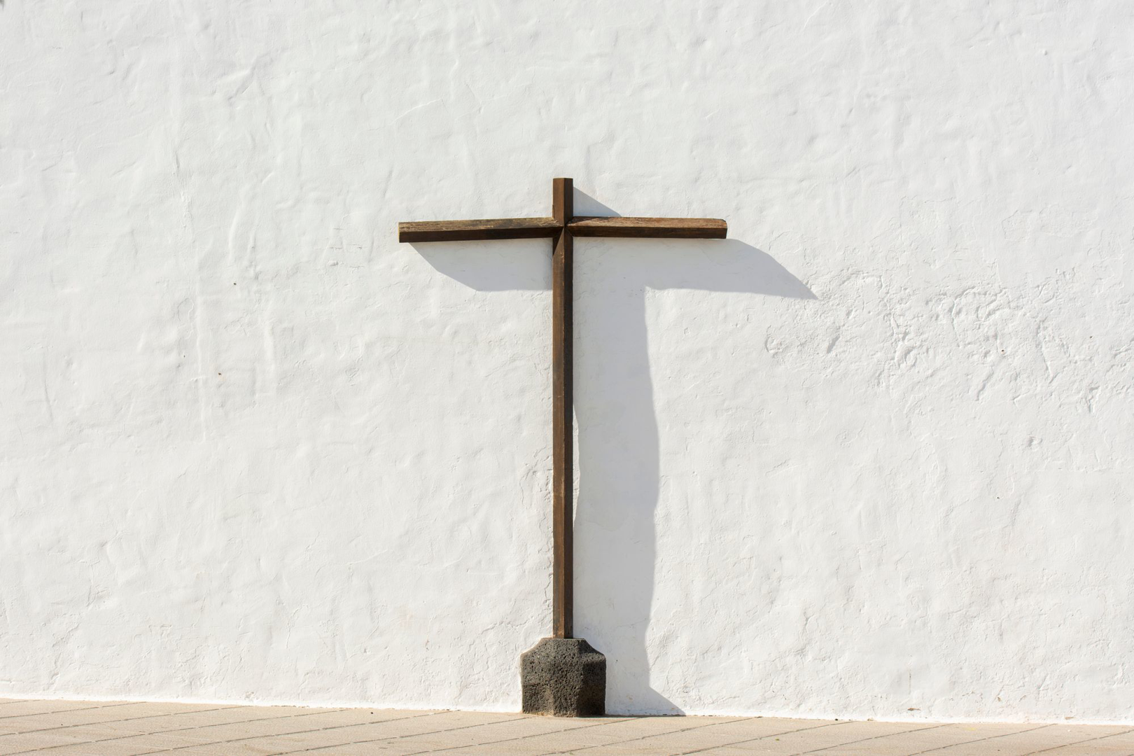 A cross on a white wall