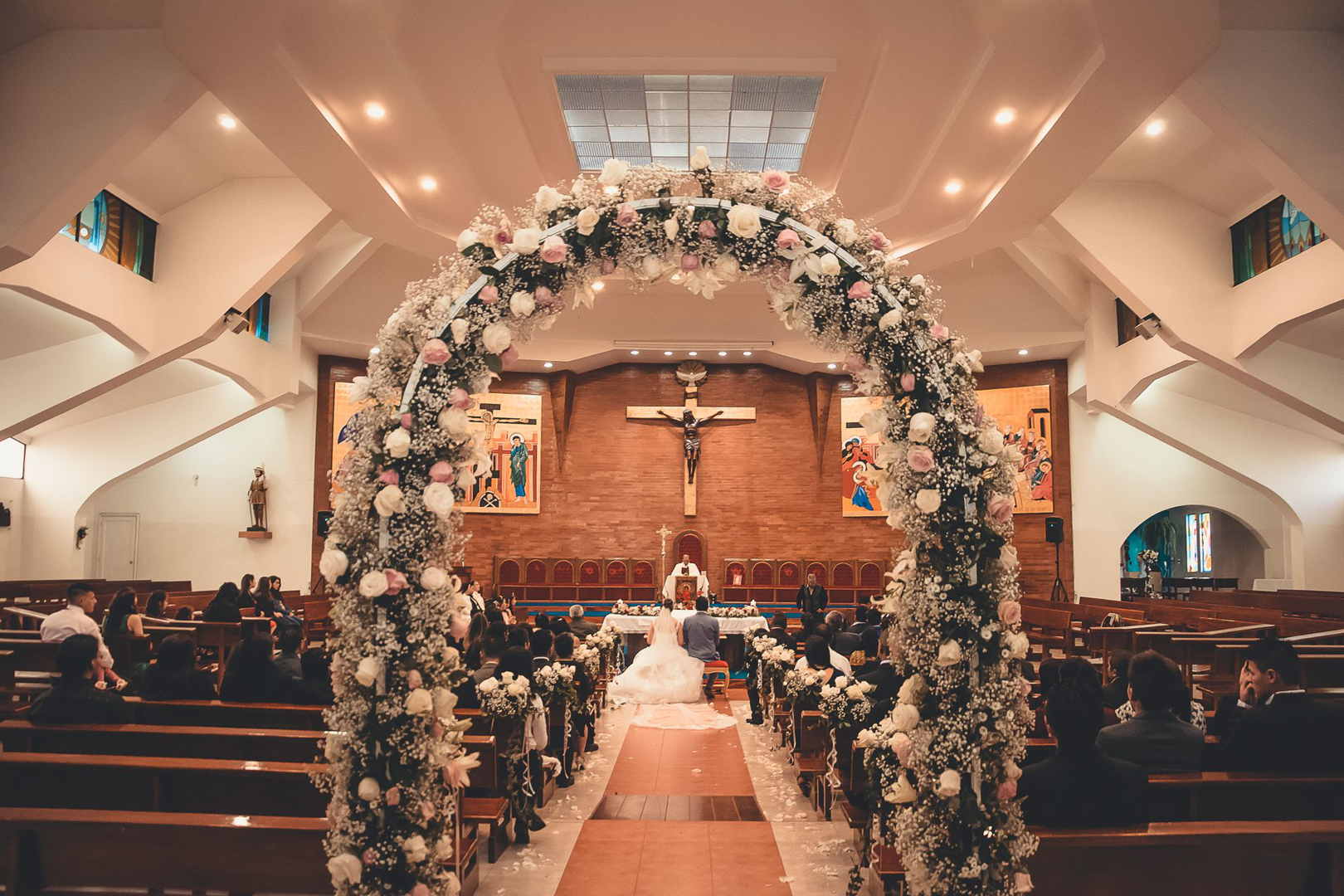 A flower arch and aisle before the altar at Mount Olive